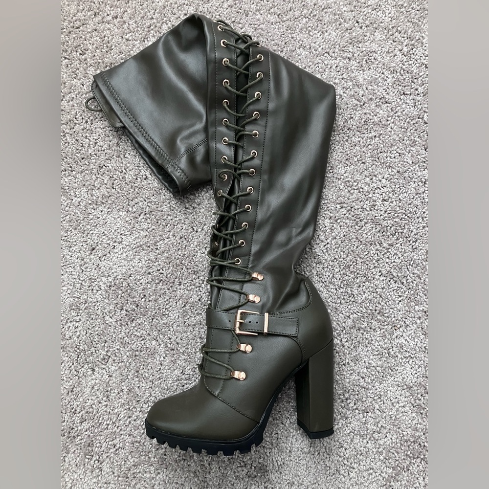 Thigh high combat heeled boots.